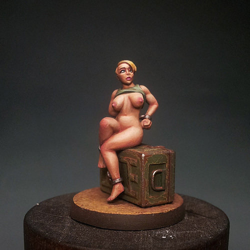 Chained Girl Sitting on Ammo Box